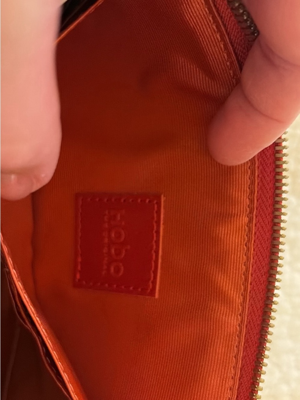 HOBO Orange Zip Pouch with Branded Leather Patch